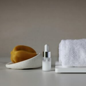 Minimal bathroom dispenser and towel demo product for HomeGlo