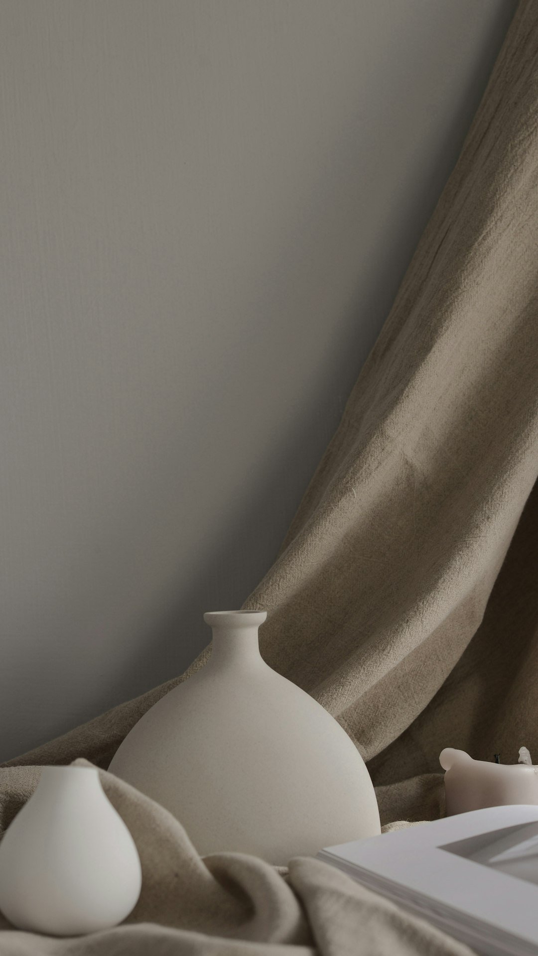 Neutral ceramic vases styled for a warm modern home