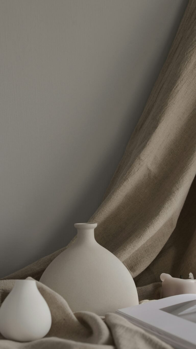 Minimal white ceramic vases styled for a warm modern home