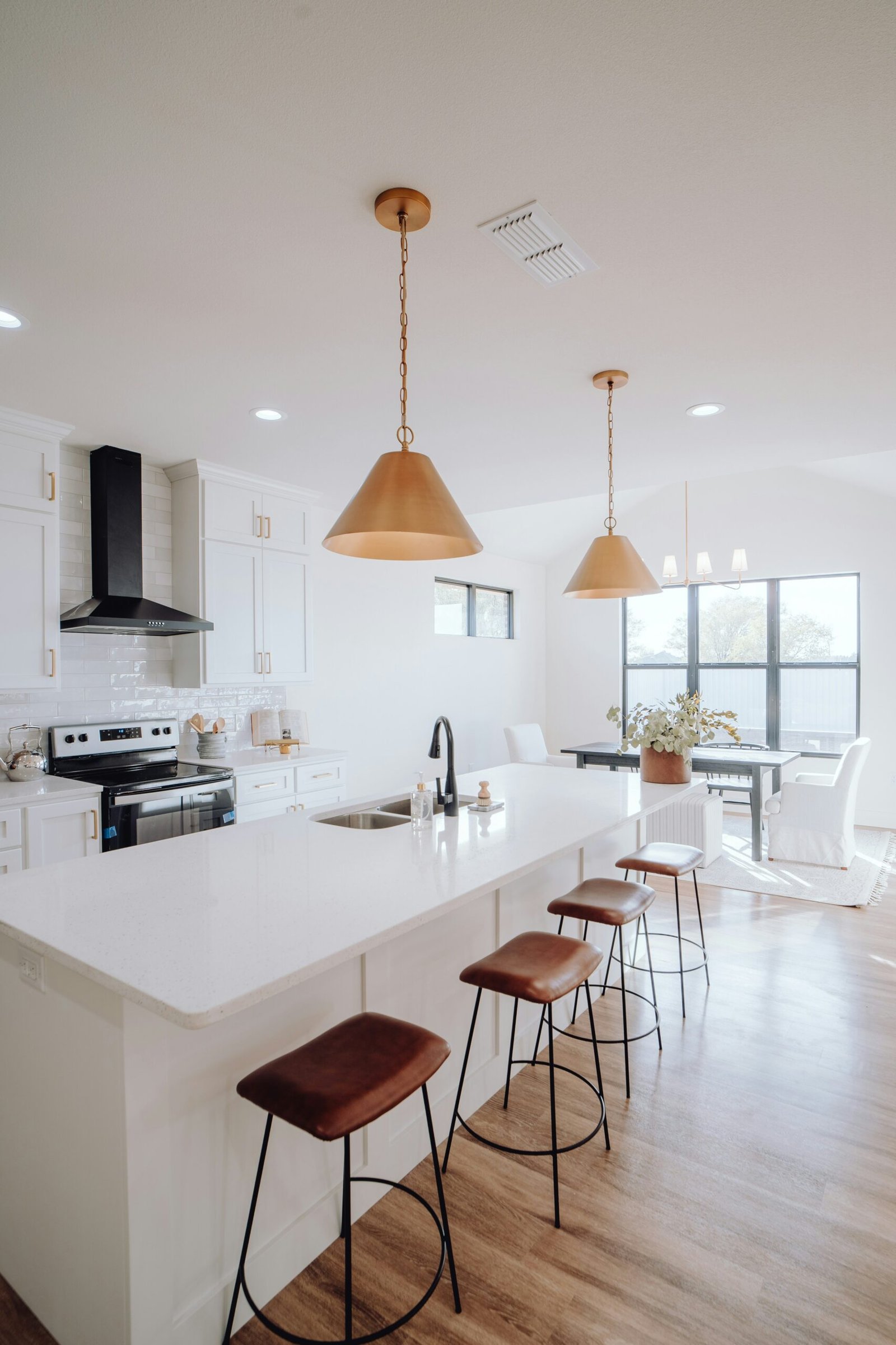 Modern neutral kitchen with island and bar stools